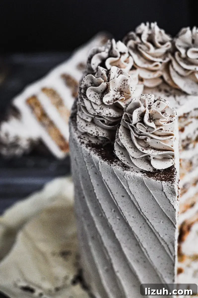 Baileys Irish Cream Cake with Gluten-Free Option 3 A light tan bailey's and coffee flavored cake topped with large buttercream swirls.