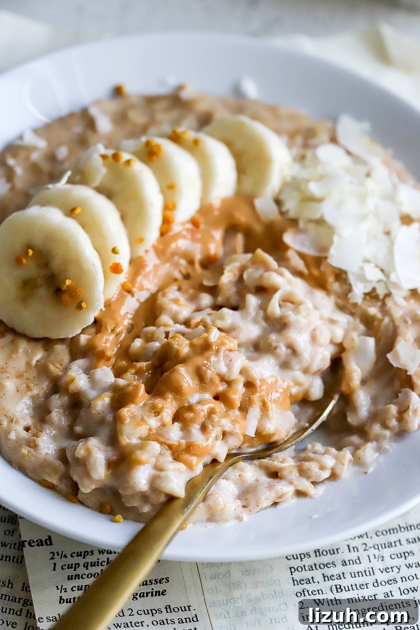 close up view of stovetop oatmeal with old-fashioned oats with banana slices and peanut butter