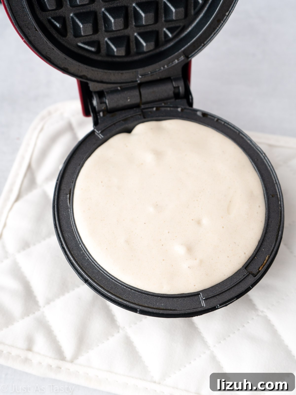 Batter in a waffle iron.