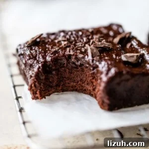 Decadent Chickpea Brownies Recipe — Fudgy, Gluten-Free Treat 6 a brownie with a bite taken out of it
