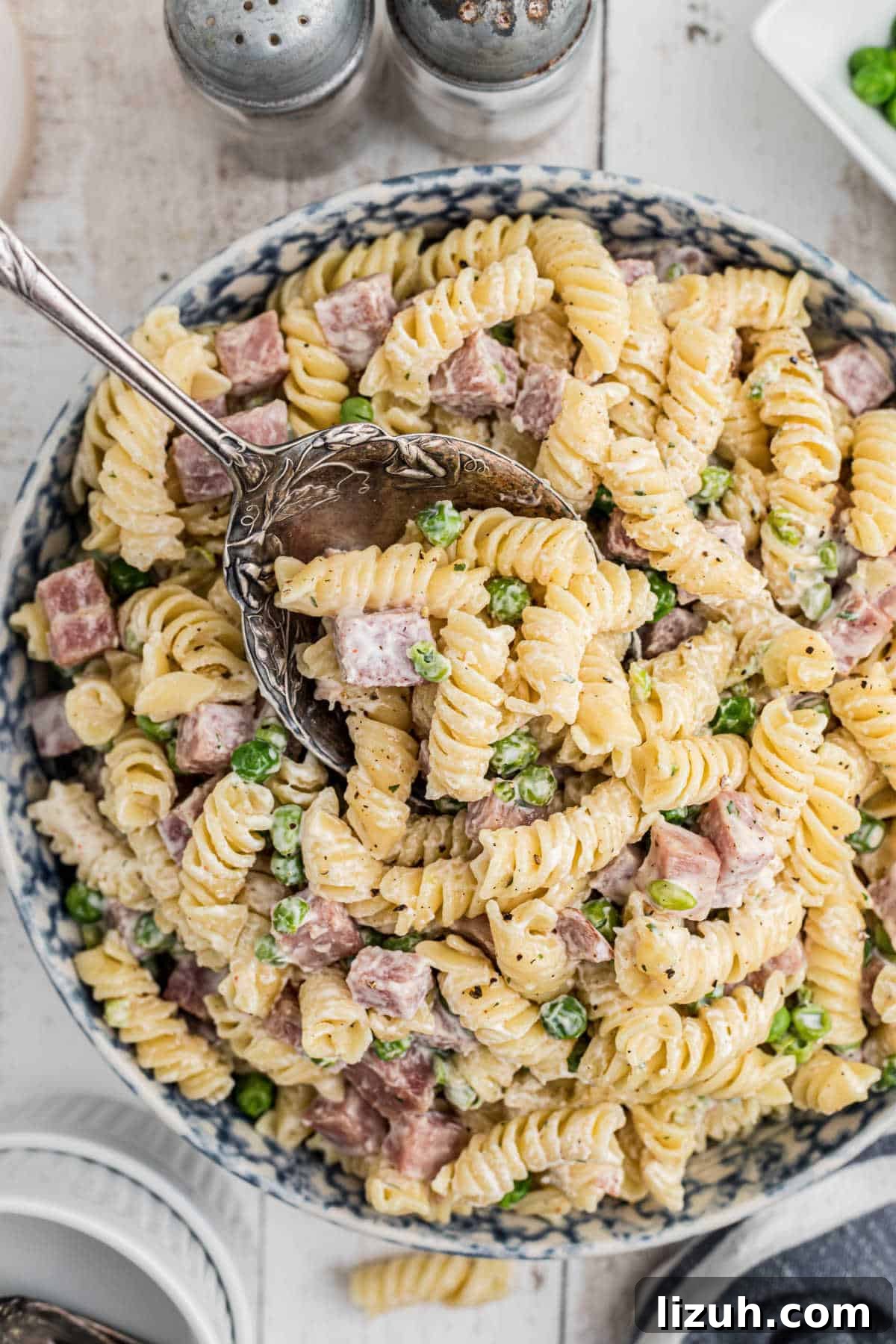Ruby Tuesday-Style Ham and Pea Pasta Salad Recipe 11 Overhead shot of a bowl of Ruby Tuesday Ham and Pea pasta salad recipe.