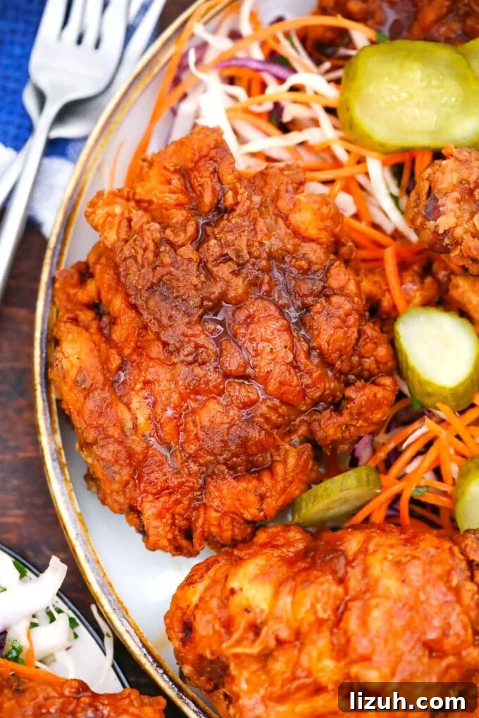 Nashville Hot Chicken: Crispy, Spicy Southern Recipe 2 close shot of a golden brown crispy fried piece of nashville hot chicken