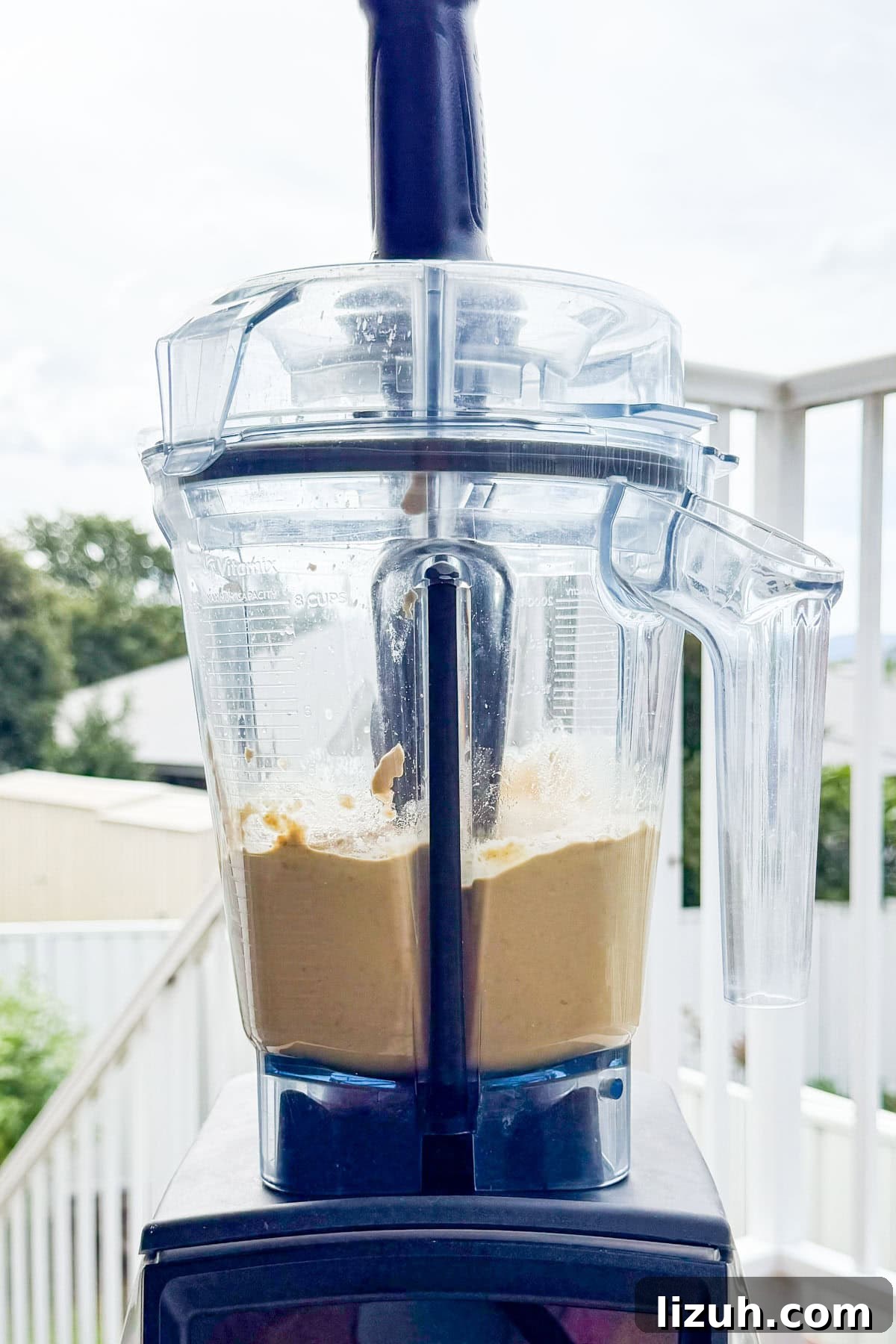 Hummus being blended in a blender.