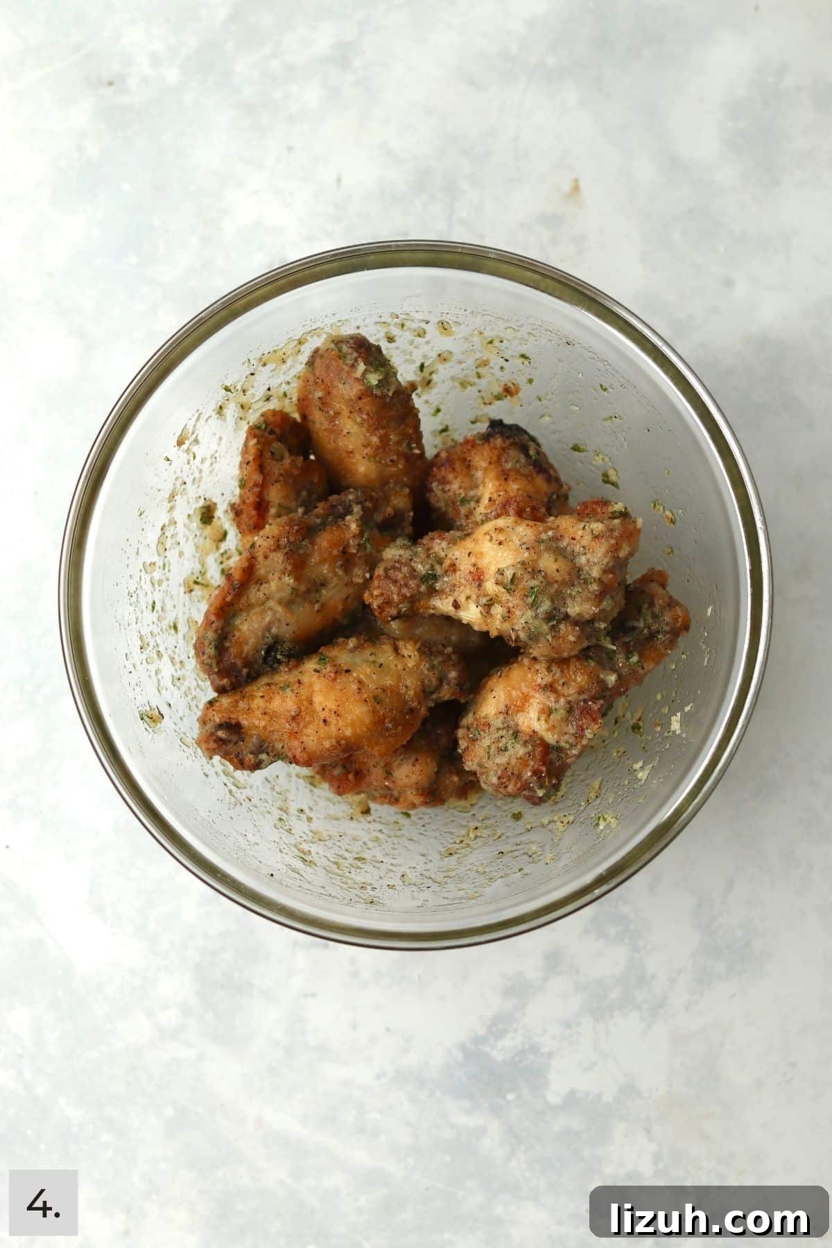 Crispy Garlic Parmesan Air Fryer Chicken Wings 7 Chicken wings tossed in garlic parmesan sauce.