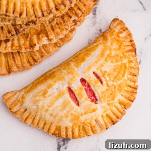 Cream Cheese Cherry pie made in the air fryer and on a white marble tabletop.