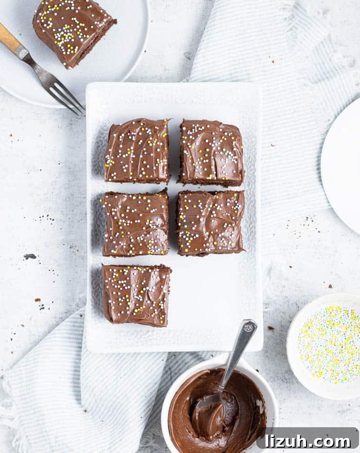 overhead view of frosted brownies on a plate