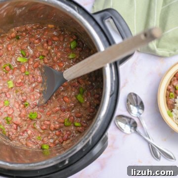 red beans and rice in an instant pot, with a spoon, next to a serving in a bowl.