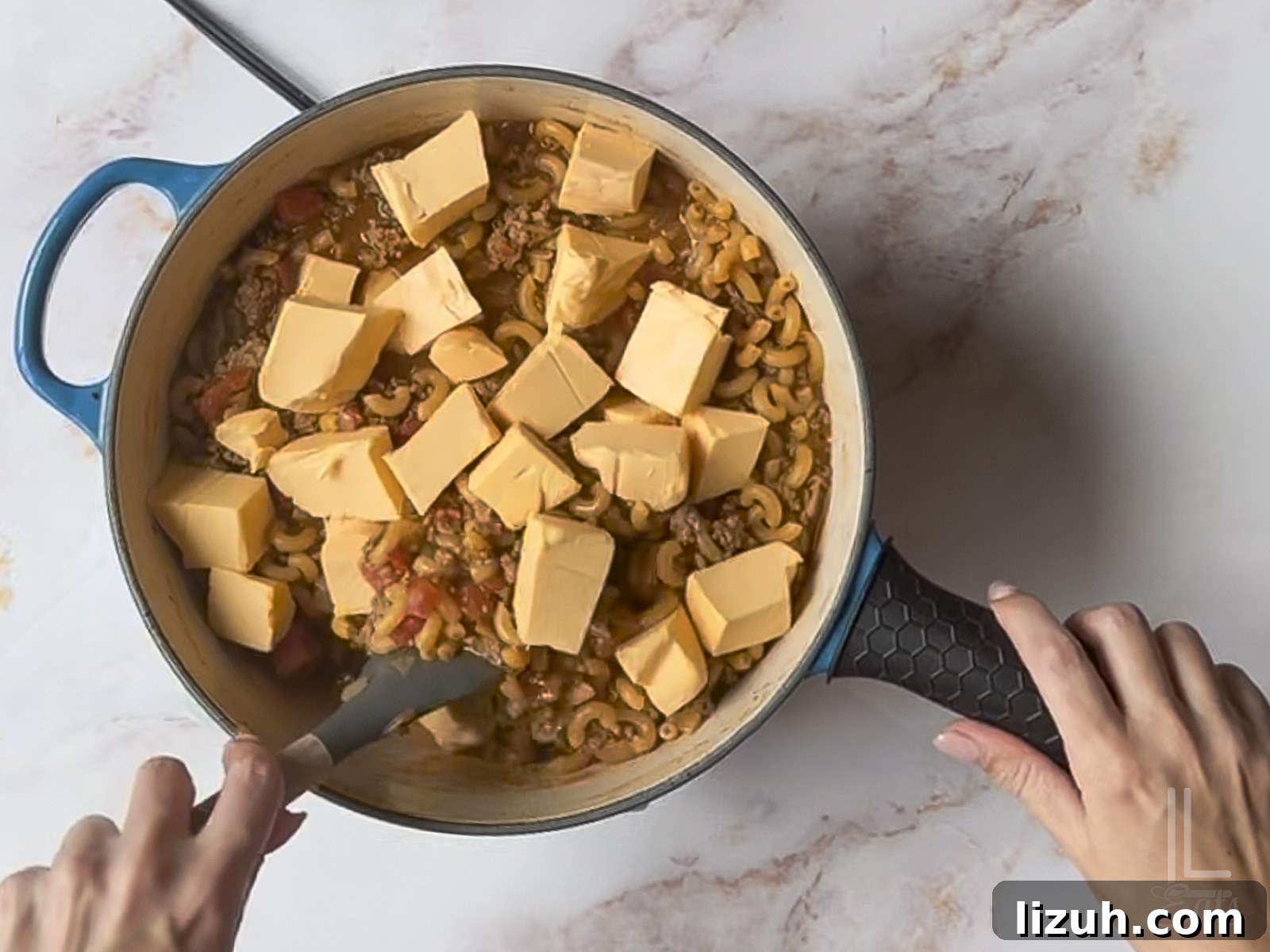 One-Pot Taco Mac and Cheese Recipe for Quick Weeknight Dinners 8 added velveeta cheese to the macaroni mixture.