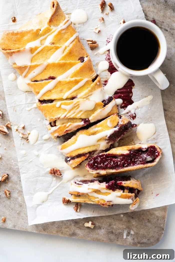Sliced keto danish with cream cheese glaze and a mug of coffee