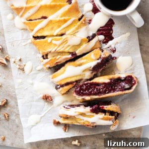 Sliced keto danish with cream cheese glaze and a mug of coffee