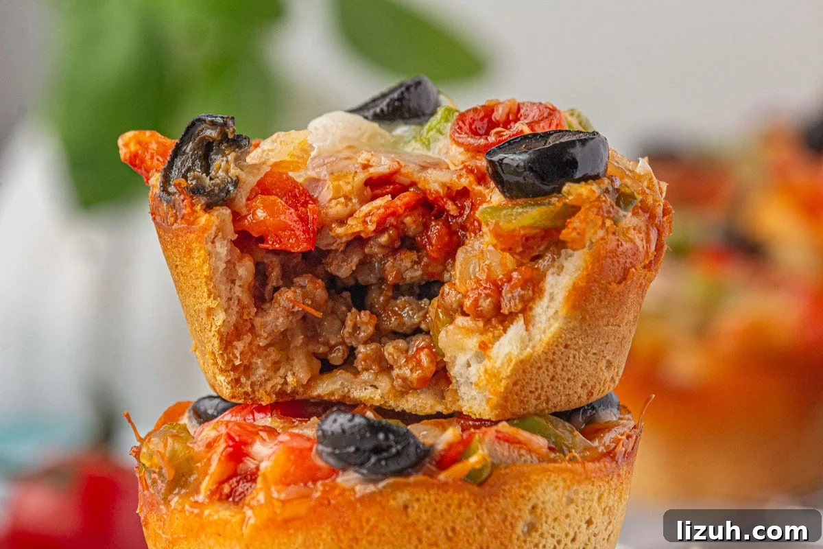 Mini Pizza Cups Recipe: Homemade Pizza Bites in 30 Minutes 8 A pizza cup cut open to show the meaty filling.