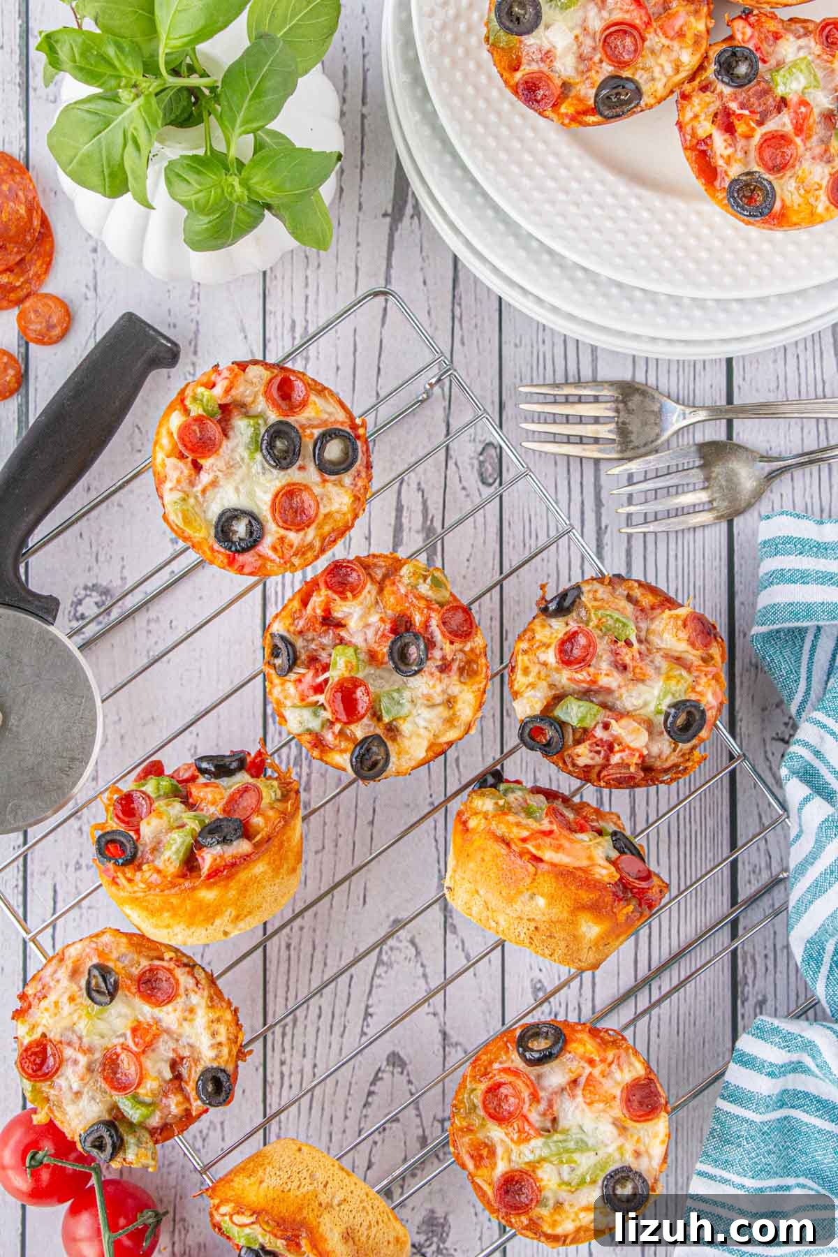 Mini Pizza Cups Recipe: Homemade Pizza Bites in 30 Minutes 9 An overhead view of easy pizza cups on a cooling rack.