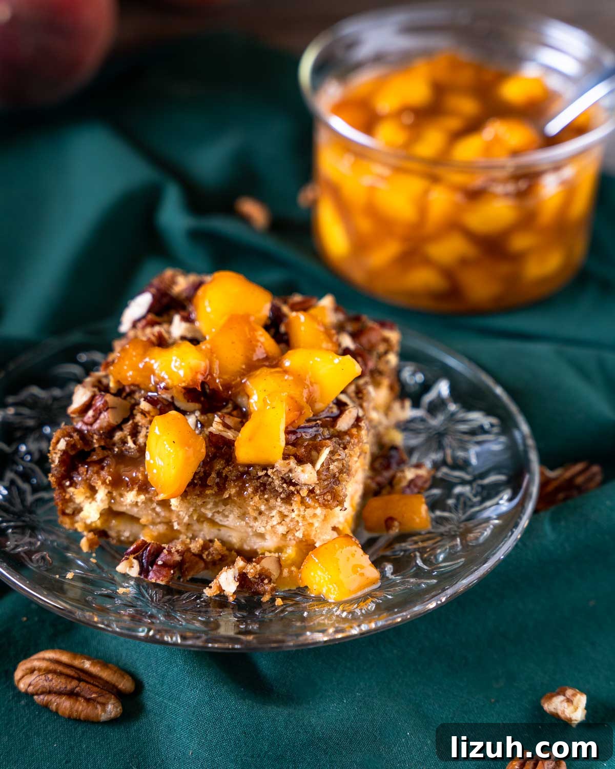 Closeup of piece with bourbon sauce on top.