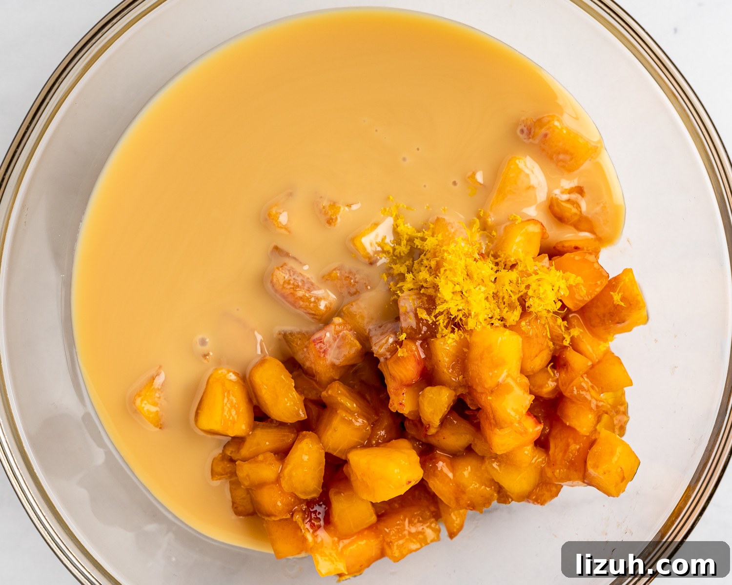 Sweetened condensed mil mixed with fresh peaches and lemon juice.