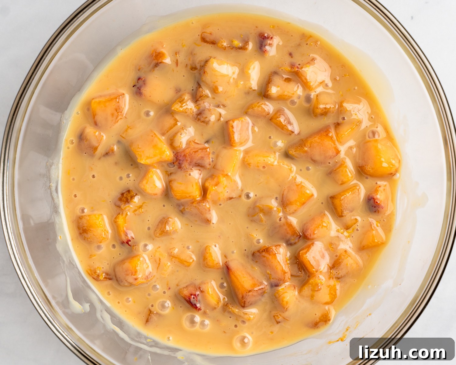 Sweetened condensed mil mixed with fresh peaches and lemon juice.