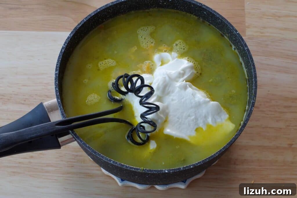 Creamy Fiddlehead and Cheese Soup Recipe 11 cheese, greek yogurt, milk being whisked into soup