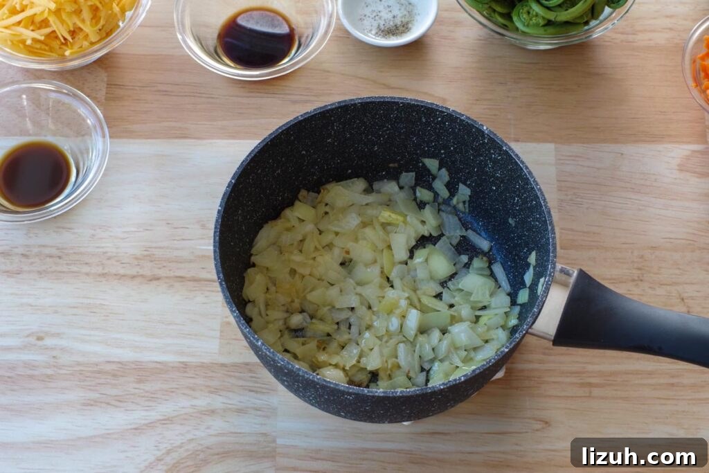 Creamy Fiddlehead and Cheese Soup Recipe 5 onions, butter and garlic cooked in pot