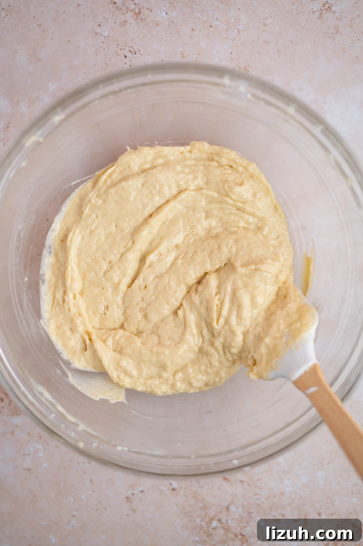 Cinnamon Walnut Coffee Cake Recipe for Weekend Baking 11 coffee cake batter in a bowl with a spatula