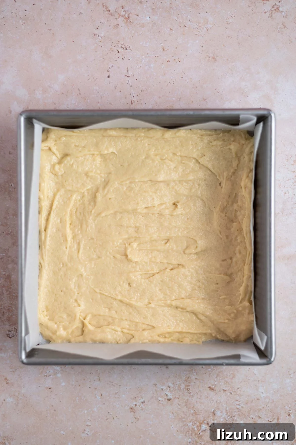 Cinnamon Walnut Coffee Cake Recipe for Weekend Baking 12 baking tin lined with parchment with a layer of cake batter
