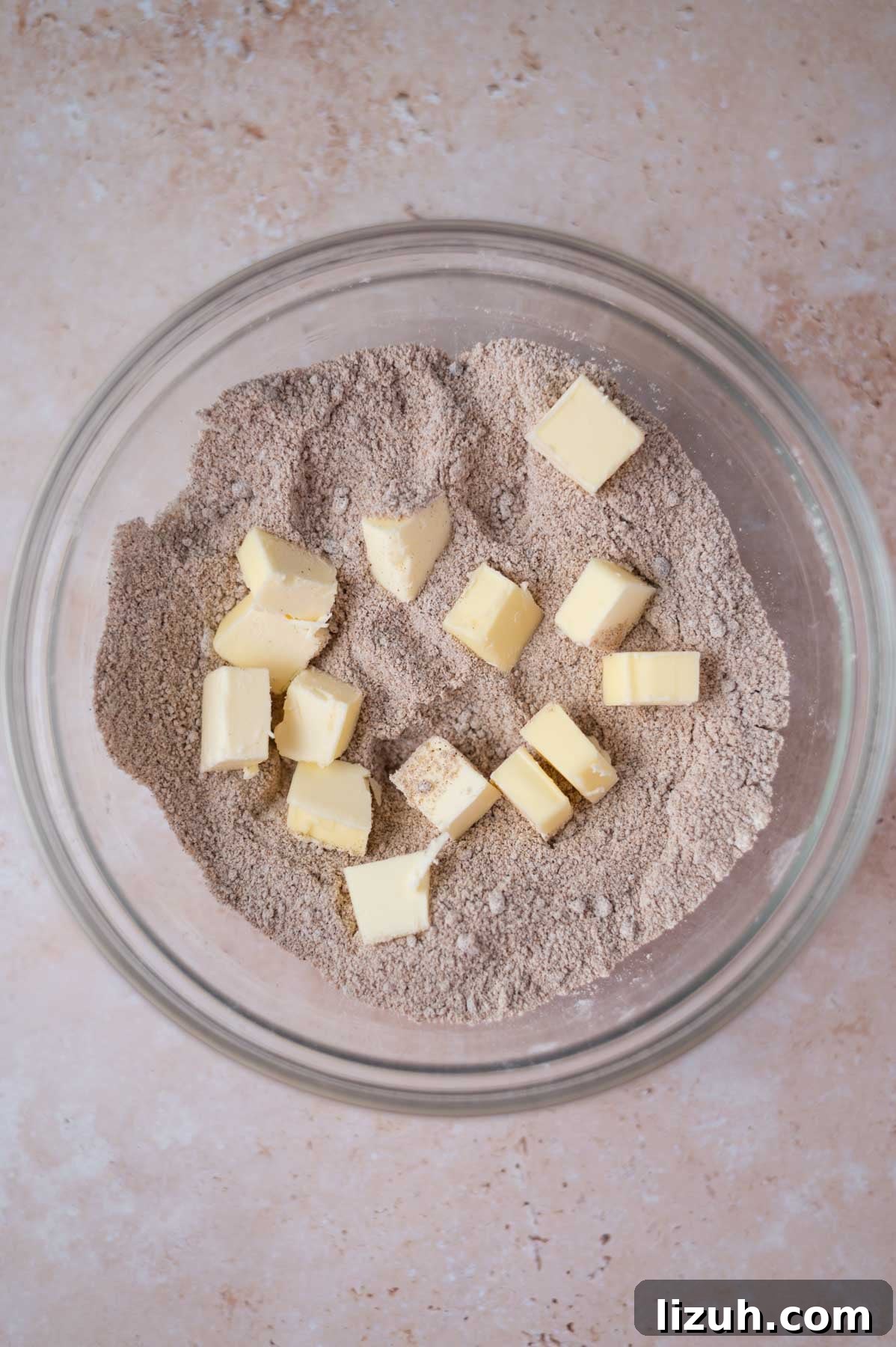 Cinnamon Walnut Coffee Cake Recipe for Weekend Baking 6 butter chunks in dry streusel ingredients in a bowl