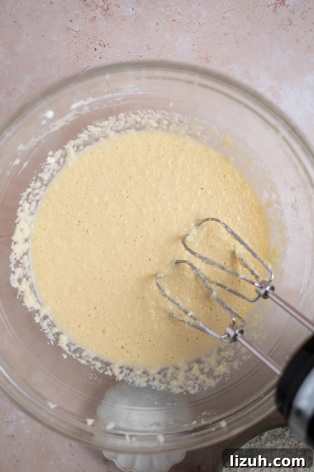 Cinnamon Walnut Coffee Cake Recipe for Weekend Baking 10 cake batter after the sour cream has been added in a mixing bowl