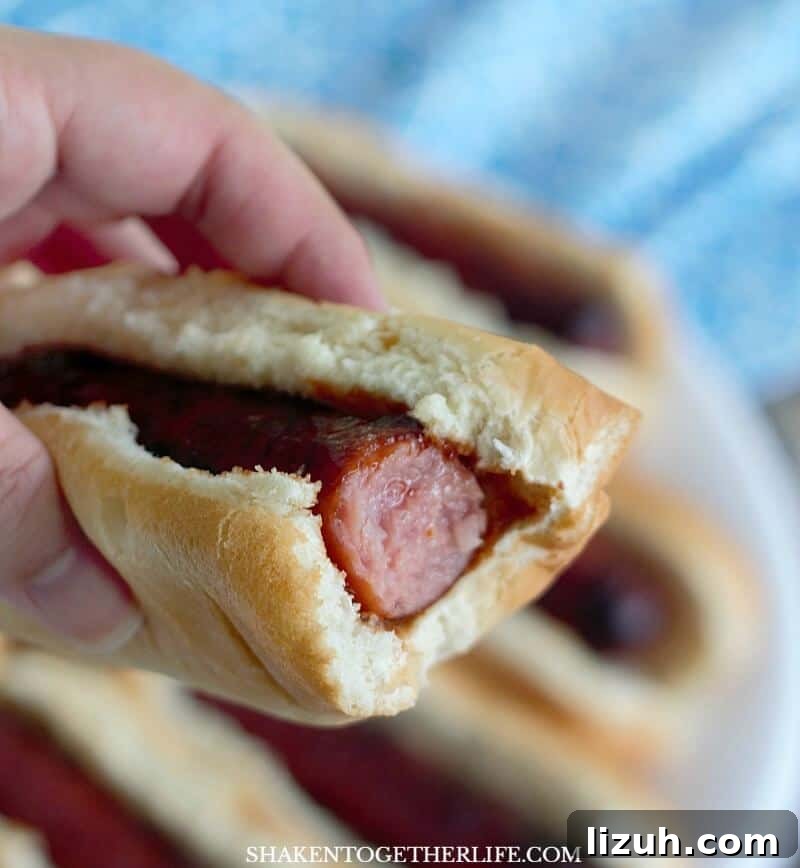 Grilled BBQ Glazed Smoked Sausage with bite taken