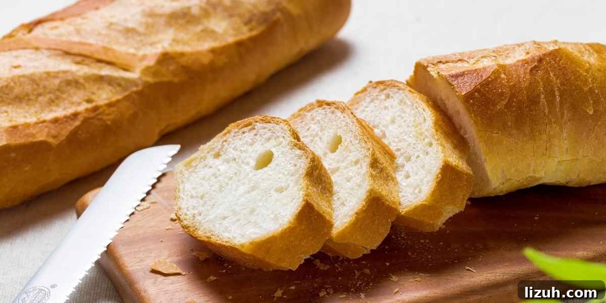 Crisp-Crust Sourdough French Bread Recipe for Rustic Loaves 3 A loaf of sliced French bread sourdough.