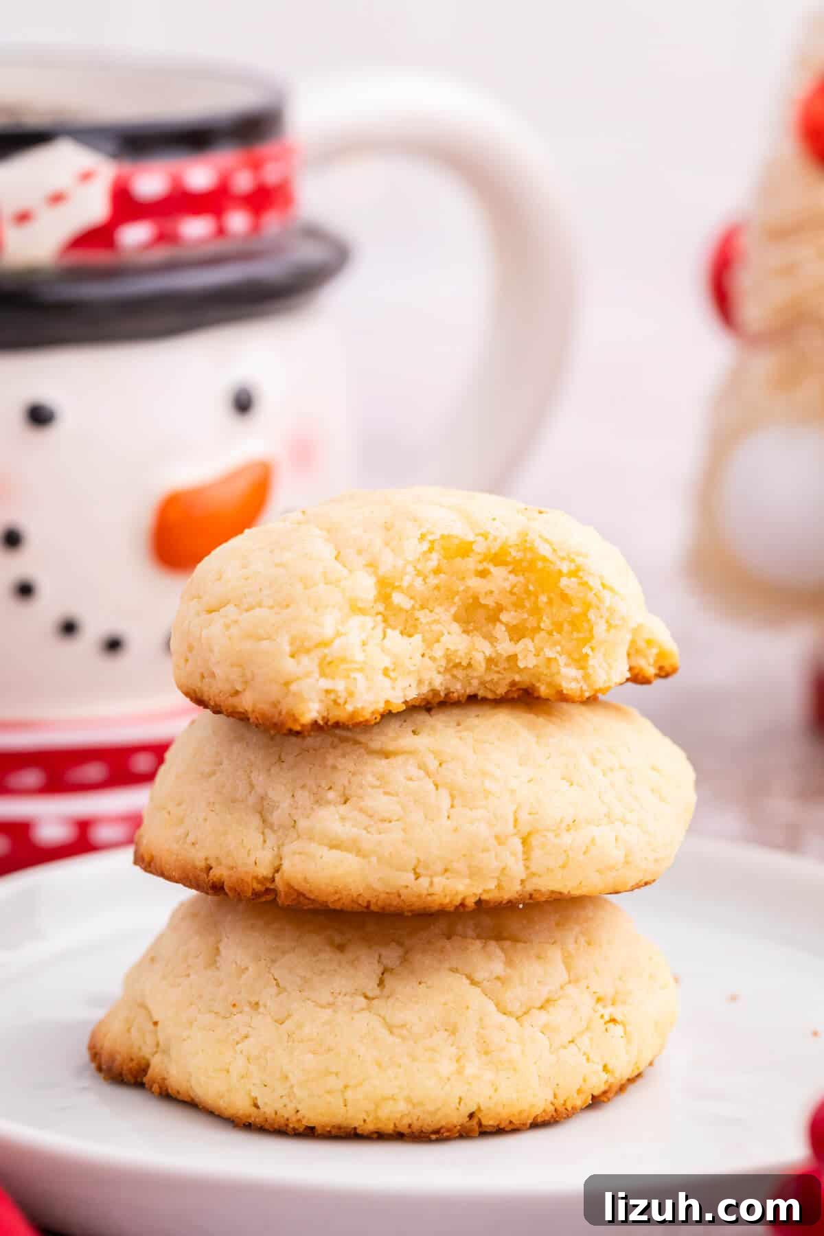 Soft and Chewy Cream Cheese Cookies — Simple Homemade Recipe 8 A stack of cookies.