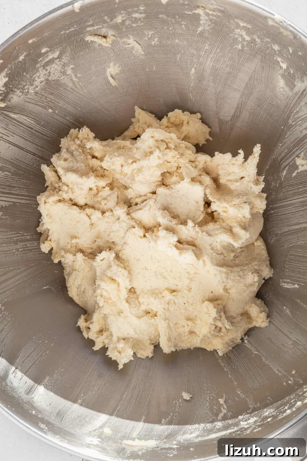 Gluten-Free Sugar Cookie Recipe for Crisp, Chewy Cookies 7 Gluten free sugar cookie dough in a large metallic bowl.