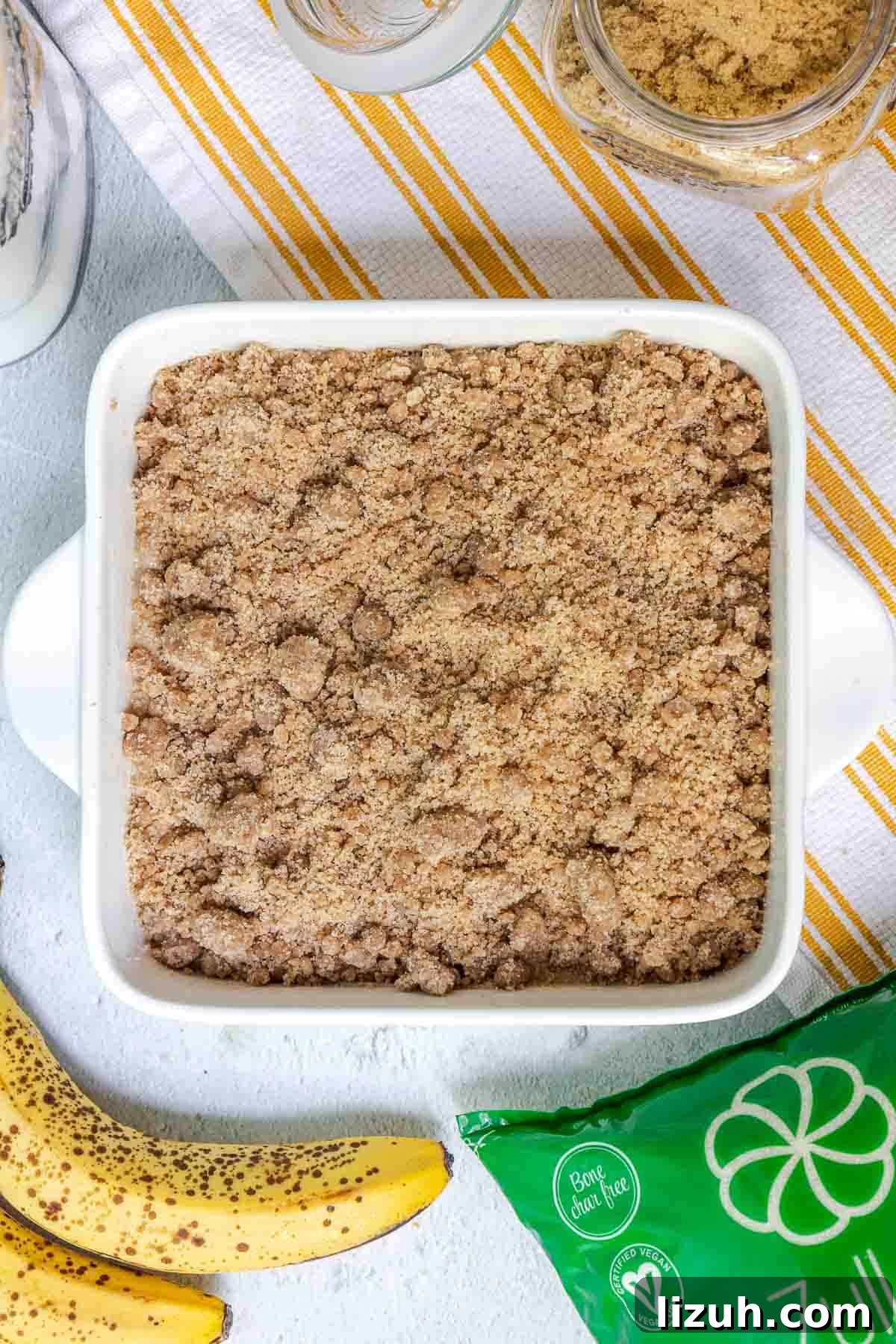 Moist Banana Sour Cream Coffee Cake Recipe for Breakfast 13 The crumble topping is sprinkled evenly over the cake batter for full coverage