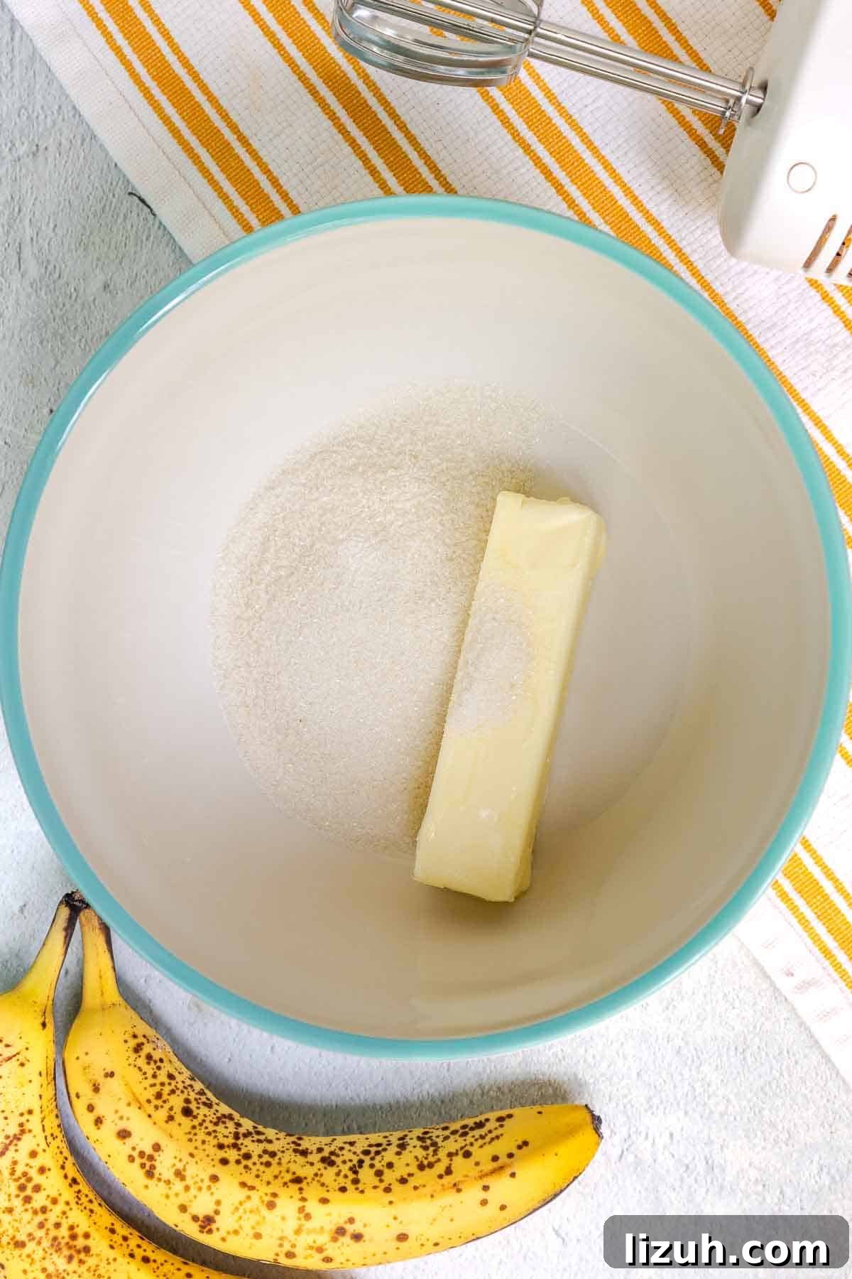 Moist Banana Sour Cream Coffee Cake Recipe for Breakfast 5 The softened butter and sugar are in a large mixing bowl