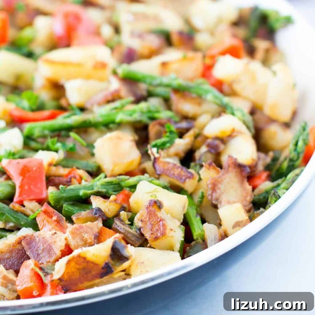 41 Perfect Side Dishes to Serve with Biscuits and Gravy 11 a skillet full of Caliente bacon potato hash with asparagus.