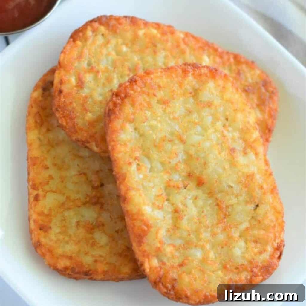 41 Perfect Side Dishes to Serve with Biscuits and Gravy 12 three hash brown patties on a plate.
