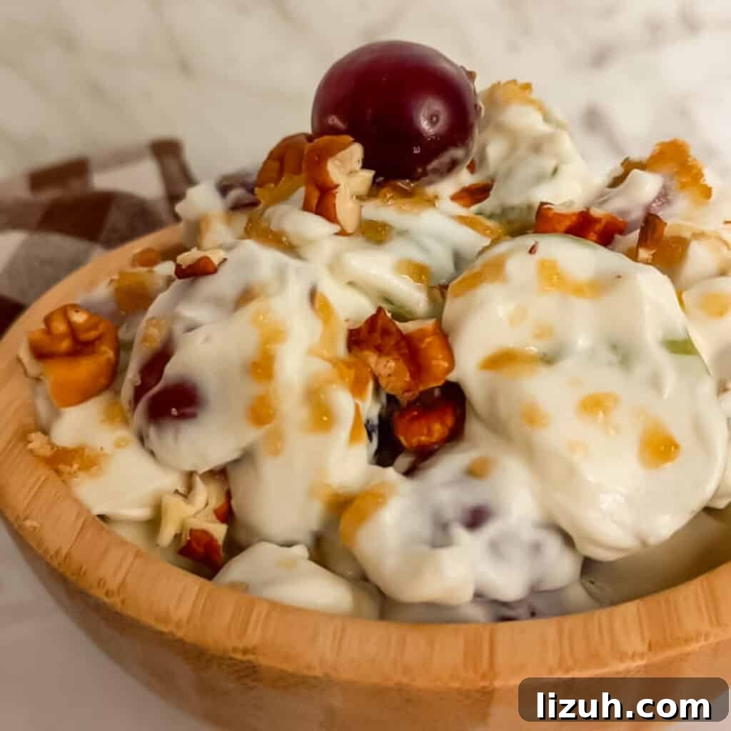 41 Perfect Side Dishes to Serve with Biscuits and Gravy 23 wooden bowl full of creamy grape salad.