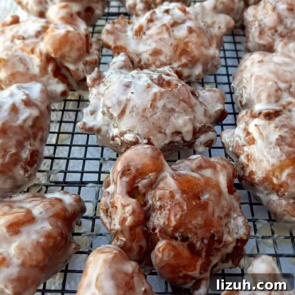 41 Perfect Side Dishes to Serve with Biscuits and Gravy 37 homemade apple fritters on a wire rack.