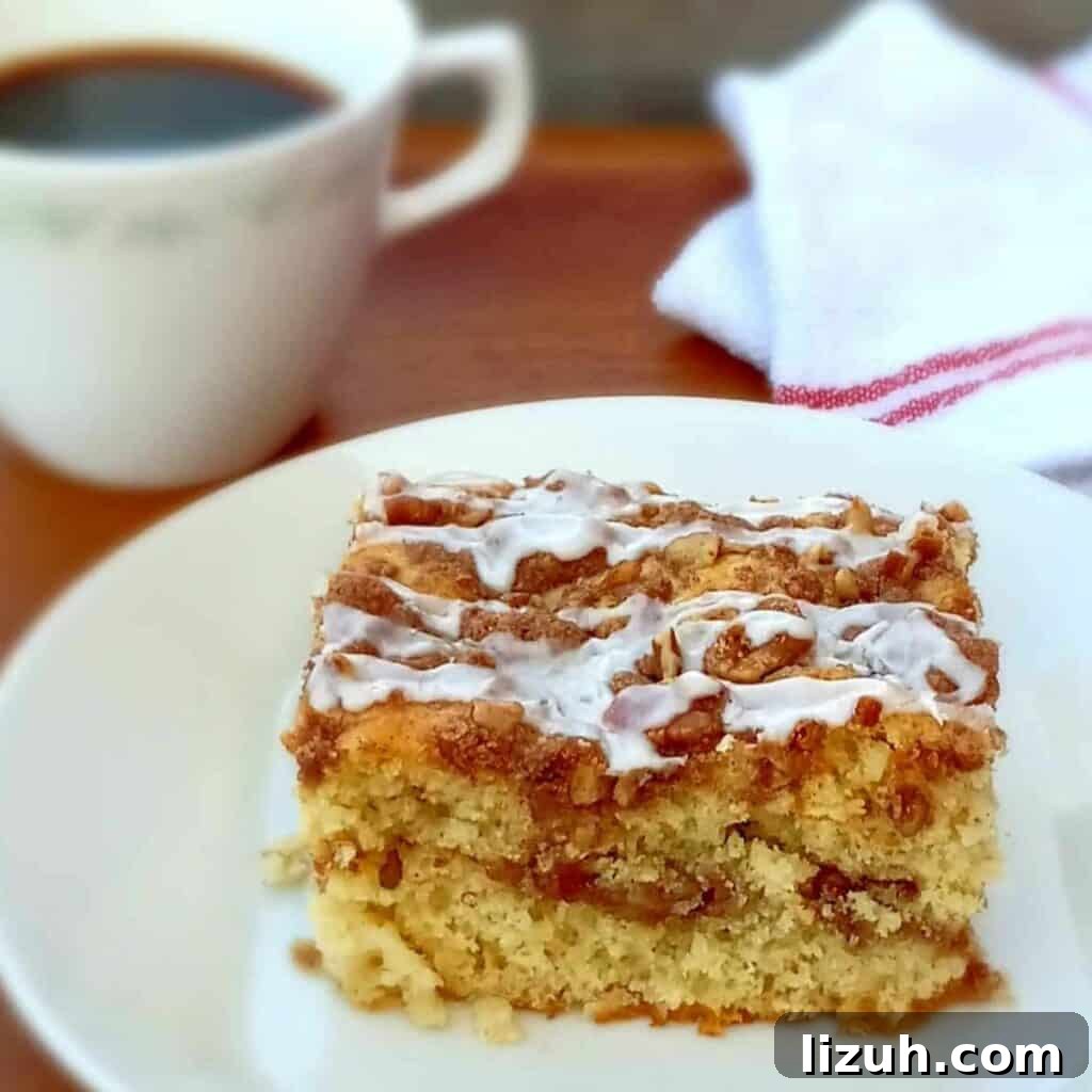 41 Perfect Side Dishes to Serve with Biscuits and Gravy 41 a slice of cinnamon streusel coffee cake on a small plate with a cup of coffee on the side.