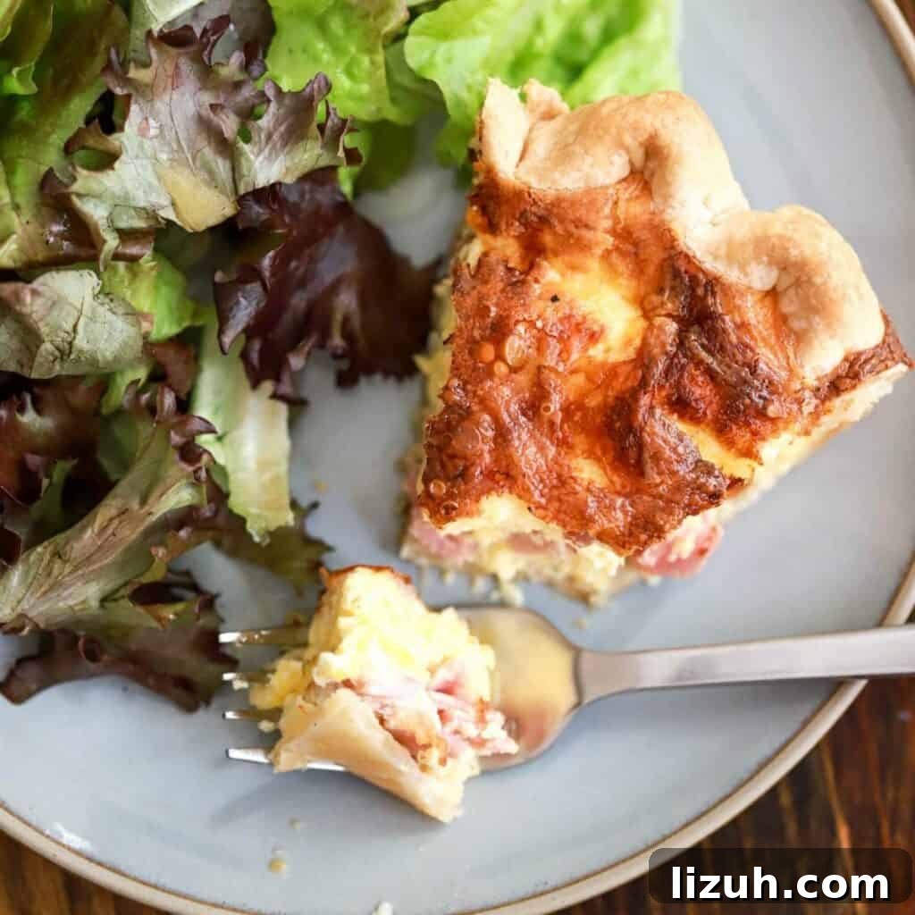 41 Perfect Side Dishes to Serve with Biscuits and Gravy 7 slice of quiche and salad greens on a plate.