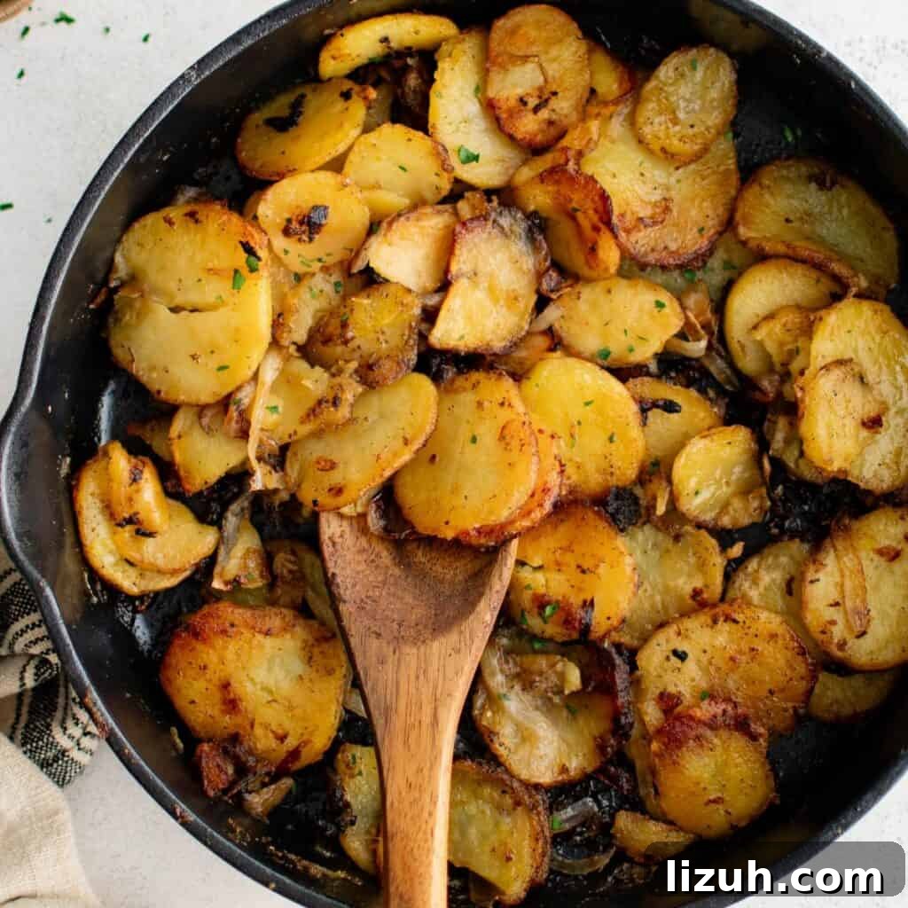 41 Perfect Side Dishes to Serve with Biscuits and Gravy 9 a skillet full of fried potatoes and onions to serve with biscuits and gravy.