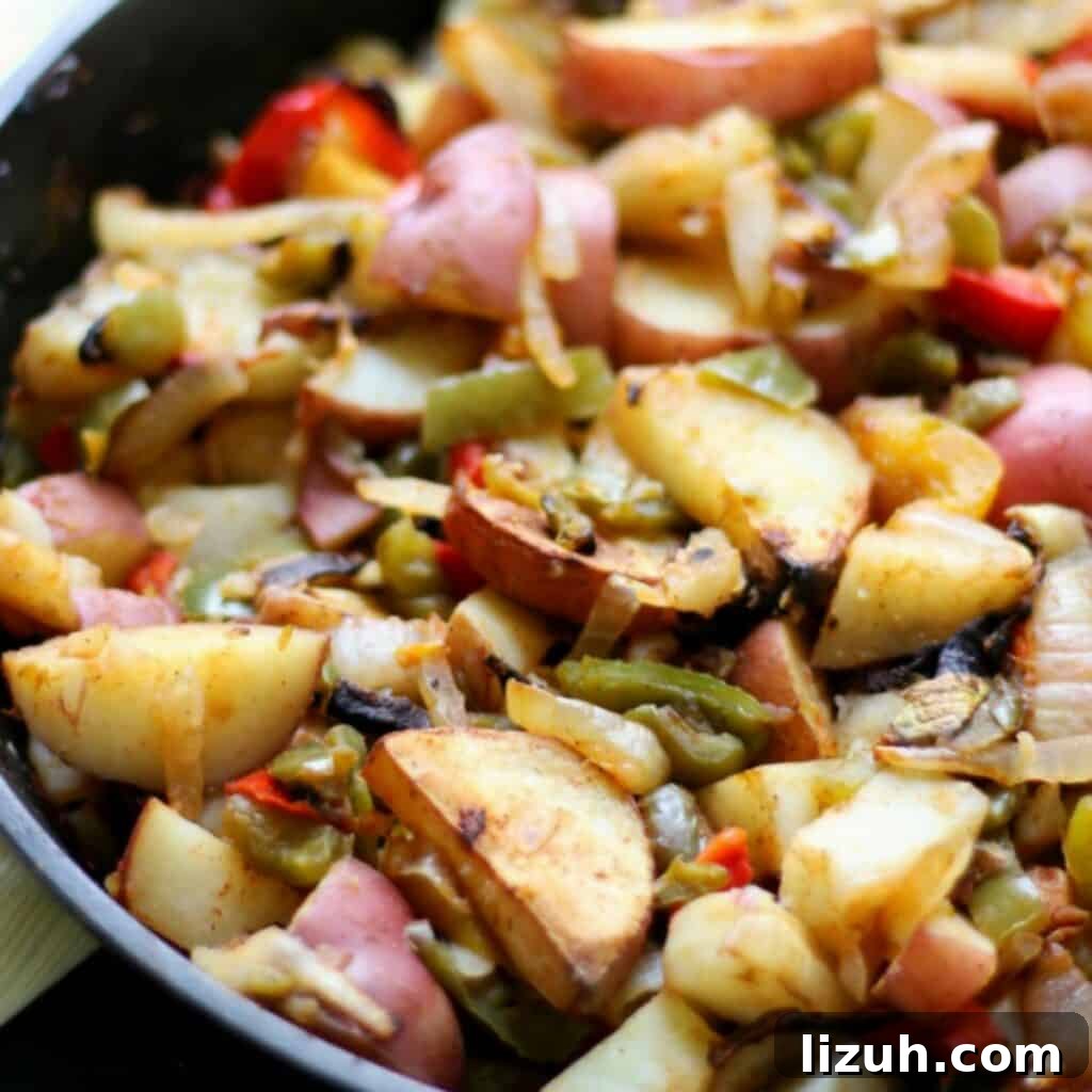 41 Perfect Side Dishes to Serve with Biscuits and Gravy 10 fried potatoes, onions, and peppers in skillet.