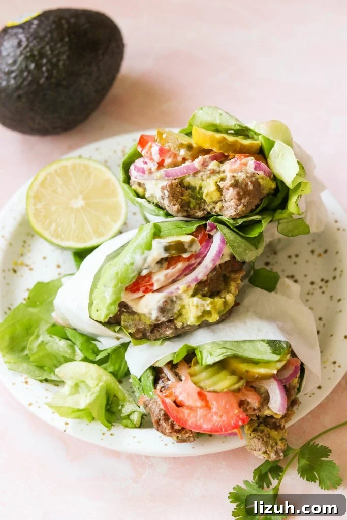 guacamole stuffed burgers on a plate