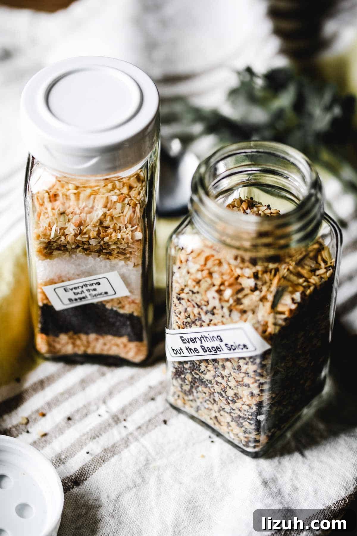 Is Everything Bagel Seasoning Gluten Free? Homemade Recipe Included 2 Two jars of everything bagel seasoning on striped towel.