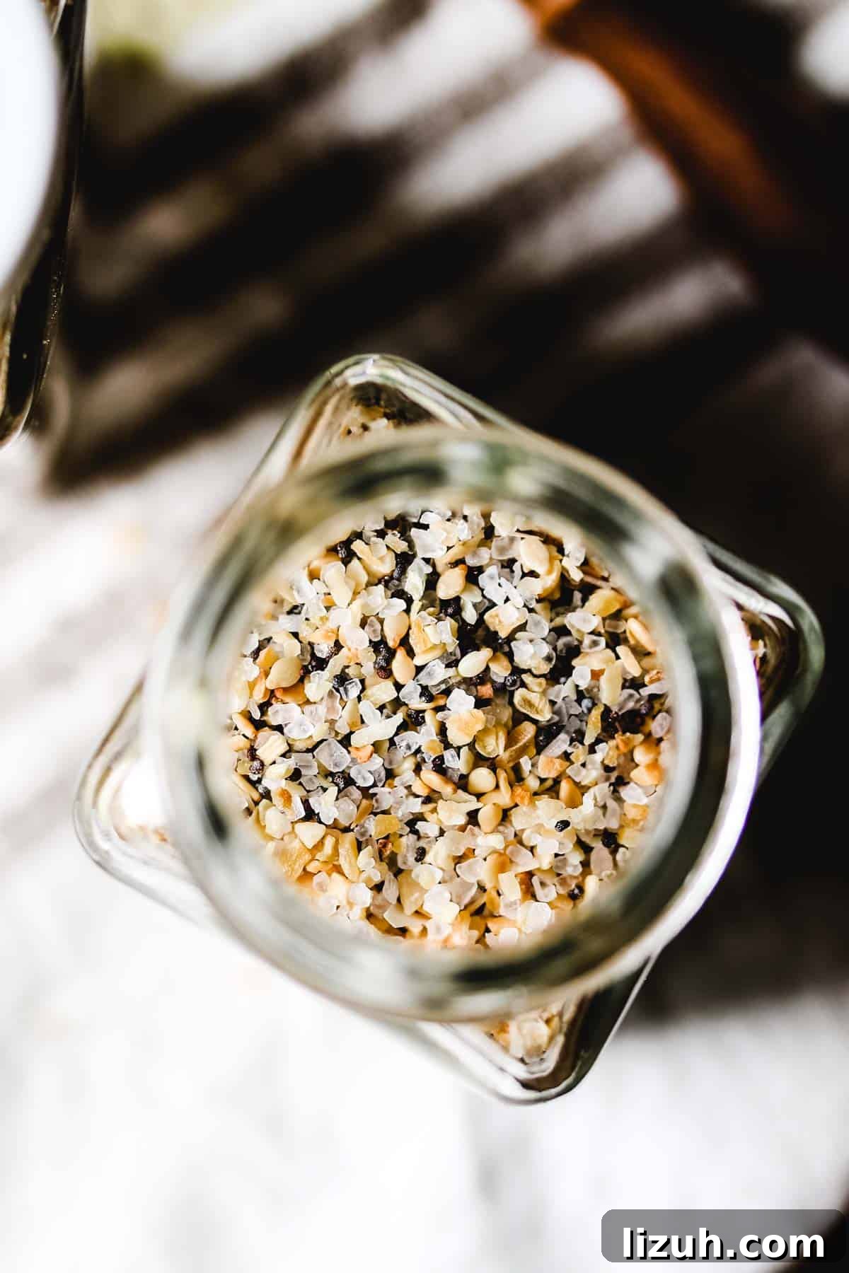 Is Everything Bagel Seasoning Gluten Free? Homemade Recipe Included 3 Overhead view of spice jar filled with everything bagel seasoning blend.