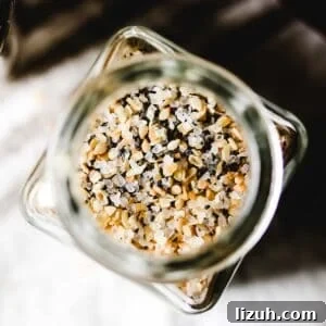 Is Everything Bagel Seasoning Gluten Free? Homemade Recipe Included 9 Overhead view of spice jar filled with everything bagel seasoning blend.