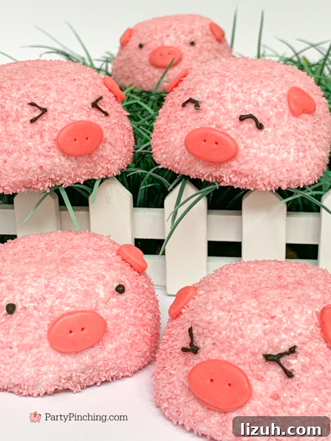 Pigs Made from Snack Cakes: Cute Party Dessert Idea 12 snack cake pigs, piggy snack cakes, piggy pig snoballs, pig snow balls, hostess snow balls, hostess snoballs, pink hostess snoball snowball coconut snack cake pig, cute pig cake, adorable pig cupcakes, best pig cake easy, best easy barnyard farm county fair party ideas