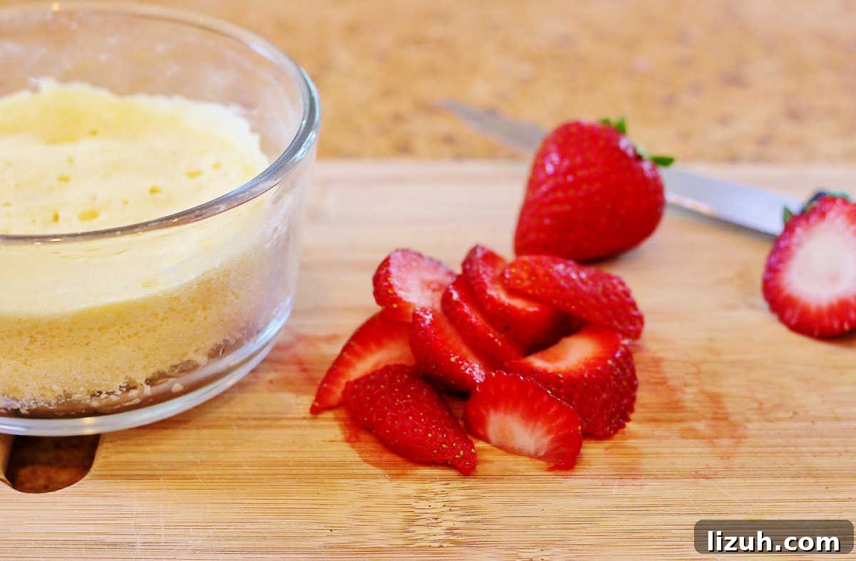 Paleo Strawberry Lemon Shortcake Recipe for Fresh Summer Dessert 3 Chopping the berries and cooking the shortcake.