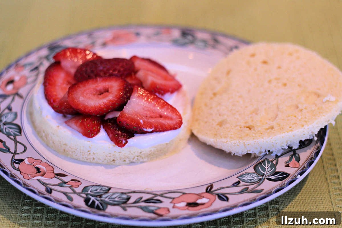Paleo Strawberry Lemon Shortcake Recipe for Fresh Summer Dessert 5 Layering cream and berries on shortcake.