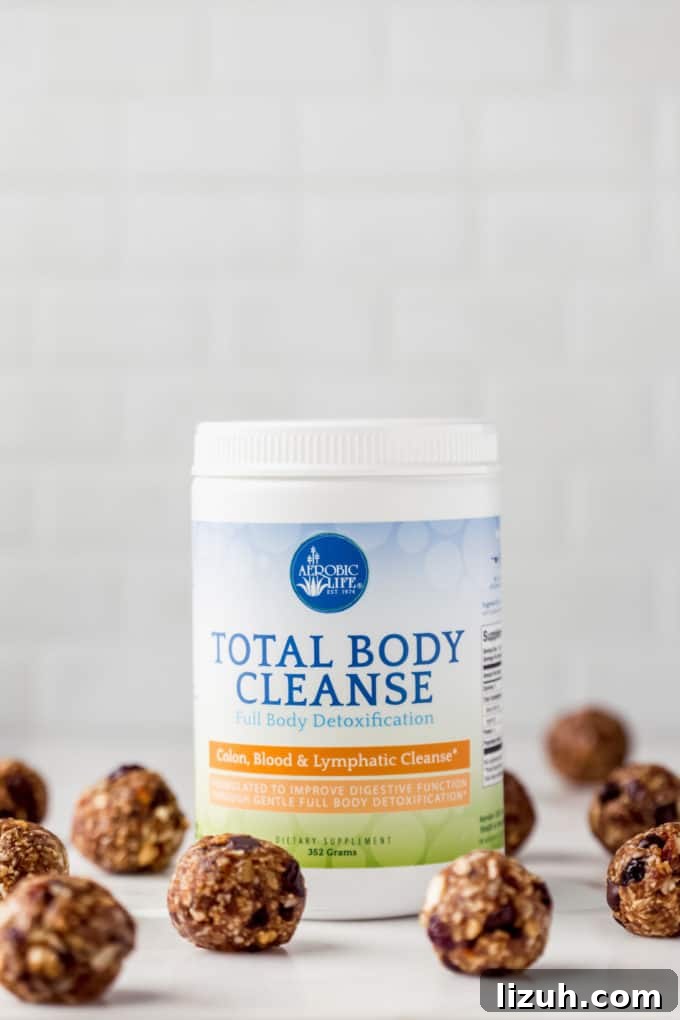 Trail Mix Energy Bites for Quick, Nutritious Snack Packs 3 a jar of nutritional brand total body cleanse with energy balls around it