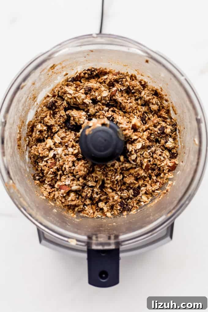 Trail Mix Energy Bites for Quick, Nutritious Snack Packs 5 a food processor with energy ball mix in it