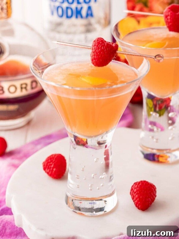 Eggnog Espresso Shooters: Holiday Coffee Cocktail Recipe 5 french martinis in a glass with a raspberry