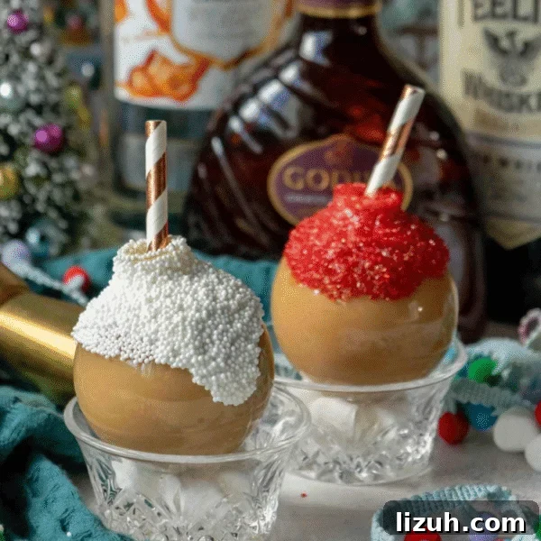 Eggnog Espresso Shooters: Holiday Coffee Cocktail Recipe 7 Two caramel-covered apples in glass bowls, topped with white and red sprinkles and striped paper straws, sit beside festive bottles and holiday decor—perfect companions for your favorite holiday drinks.